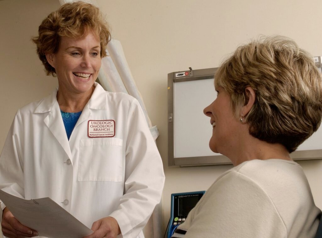 Doctor smiling while consulting with a patient during an appointment
